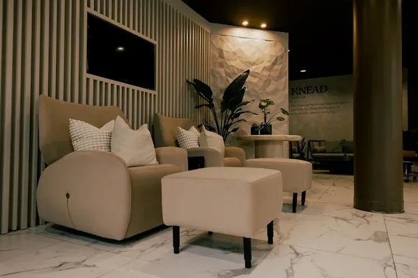 Lounge seating with a slatted feature wall at Knead Kitsilano